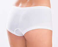 Step 3 inserting gluteal implant into dissected space and suturing incision at NANA Plastic Surgery